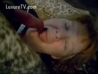 Whore deepthroats a dog